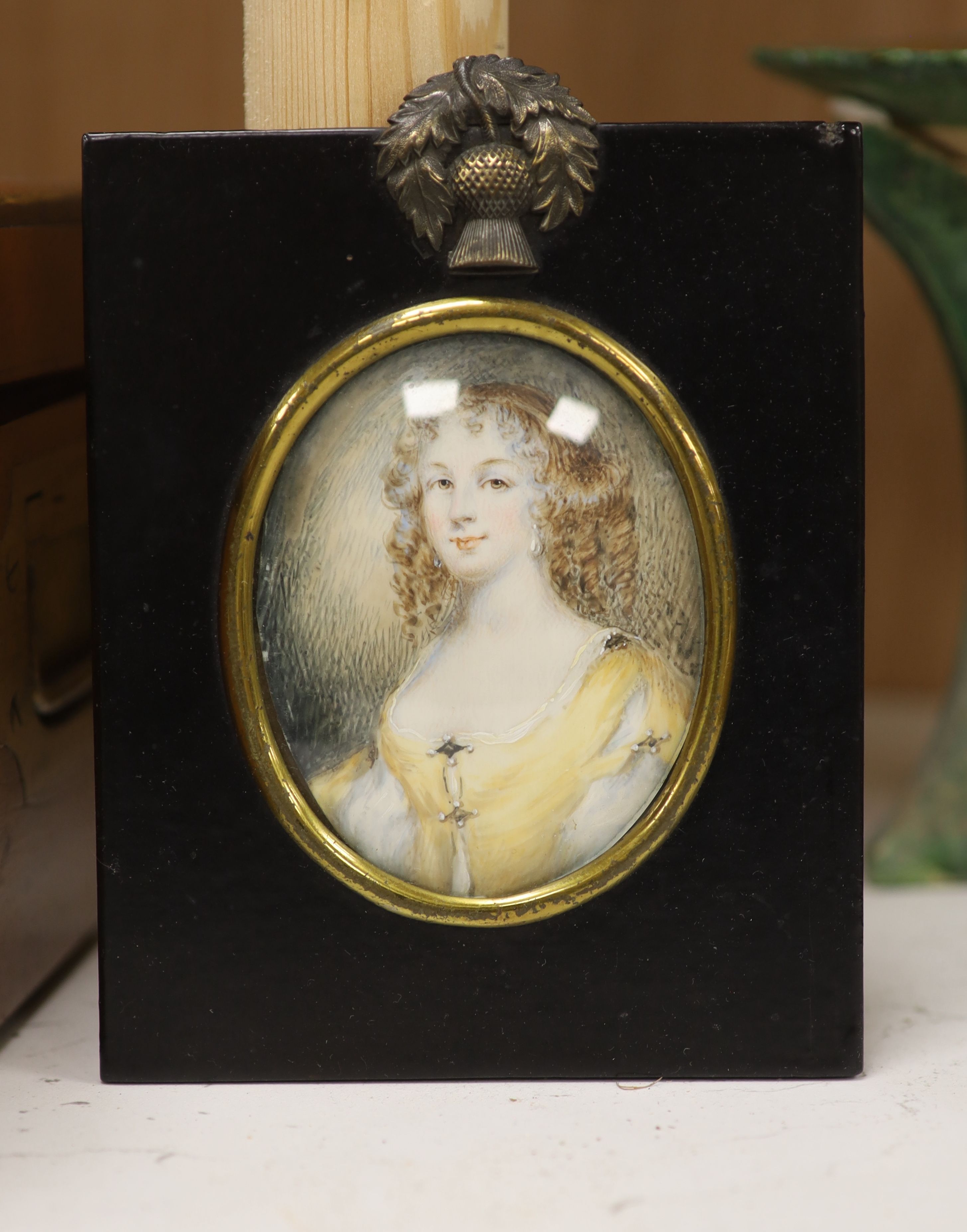 English School c.1900, watercolour on ivory, Miniature of a lady, 9 x 7cm